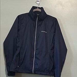 Columbia women’s Active Fit Navy Blue Packable Windbreaker Adjustable bungees.